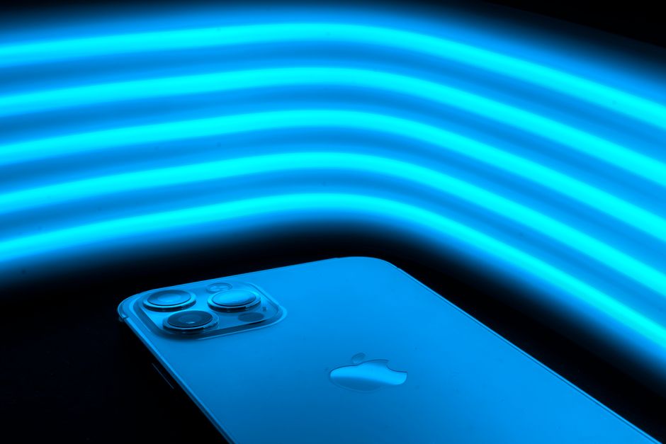 Close-up of a smartphone with blue neon lines, illustrating modern technology.