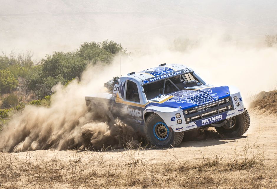 Action-packed off-road racing with a rugged vehicle in Ensenada, Mexico's dusty terrain.