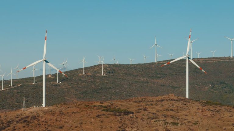 A scenic view of wind turbines on a hill in Çeşme, İzmir, Türkiye, harnessing wind energy efficiently.