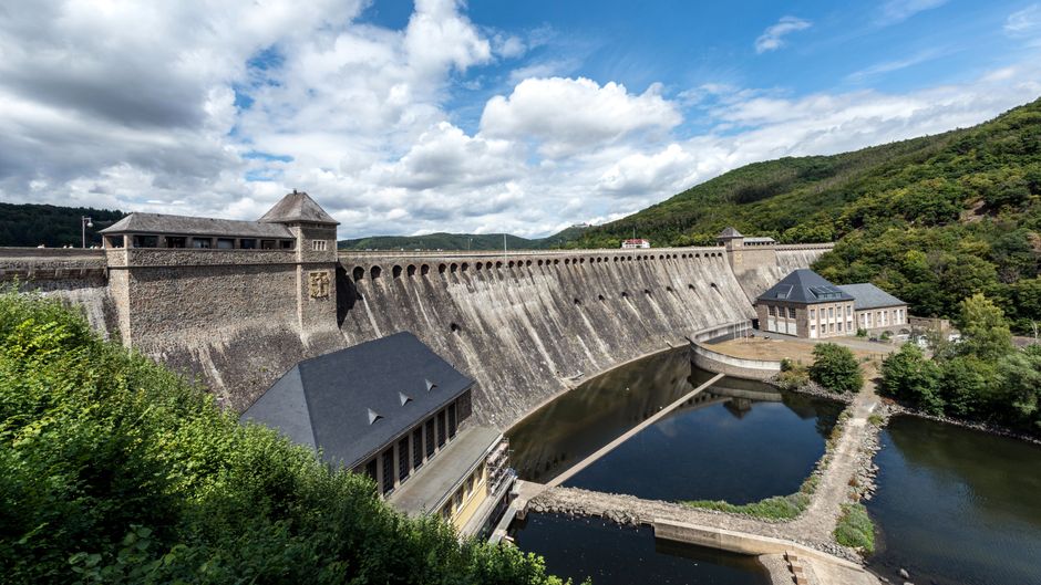 Scenic view of the historic Edersee Dam with lush surroundings, located in Edertal, Germany.