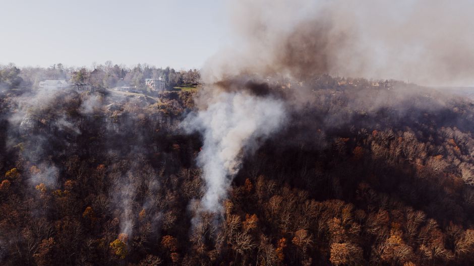Aerial shot of smoke rising from a forest fire near Chattanooga, Tennessee.