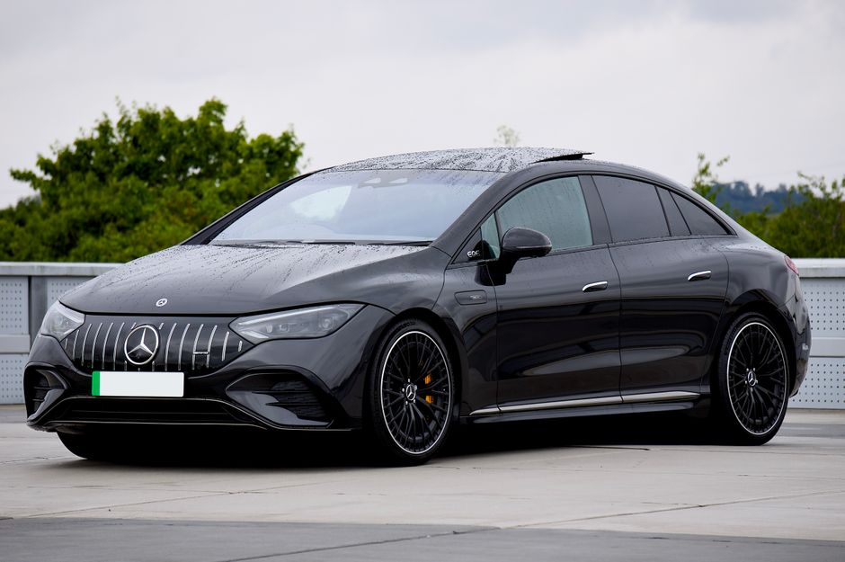 A stylish black Mercedes-Benz EQE electric vehicle parked outdoors. Perfect for automotive enthusiasts.