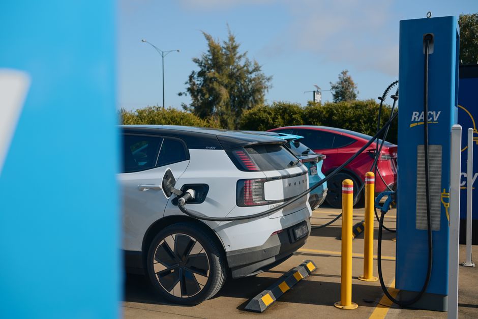 Electric vehicles charging at a RACV station in Barnawartha, VIC, Australia, promoting sustainable transportation.