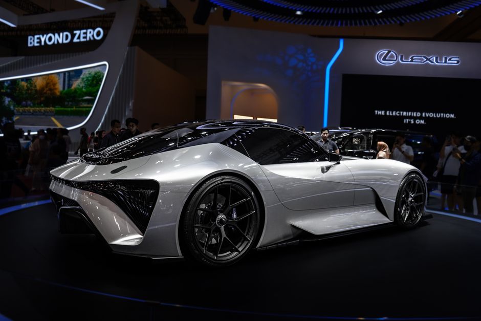 Modern electric sports car displayed at international auto show. Sleek design and futuristic features.