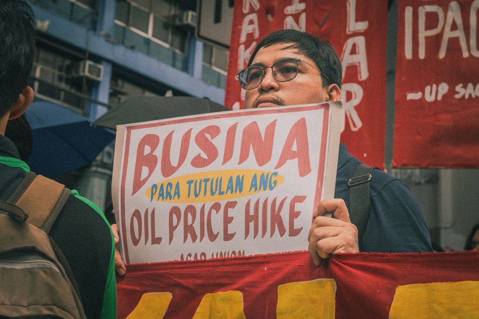 Protester holds a sign against oil price hikes during a rally in Metro Manila, Philippines.