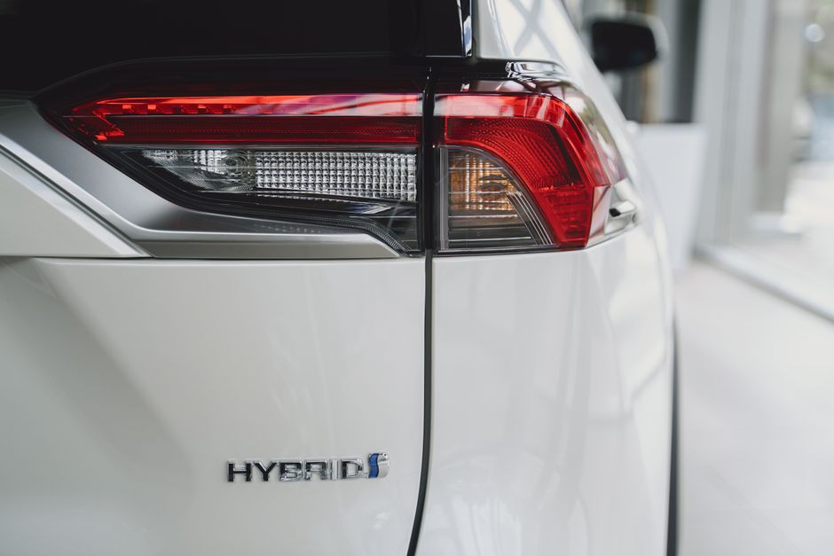 Elegant close-up of a hybrid car tail light showcasing modern automotive design.