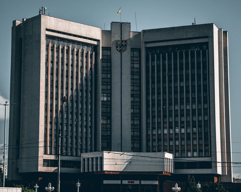 Front view of a striking government building in Ukraine under a clear sky.