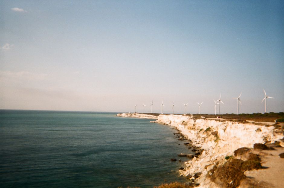 Beautiful view of wind turbines along the cliffs of Bozcaada Island, Türkiye.
