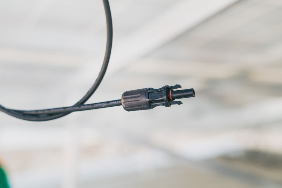 Detailed close-up shot of an electrical connector cable with a blurred background.