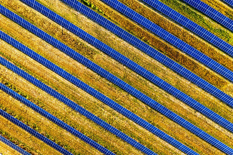 Vibrant aerial shot of solar panels in a field, showcasing renewable energy in Red Wing, MN.