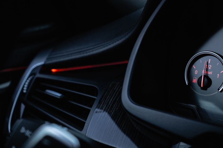Detailed shot of a car's interior highlighting the gauge and air vent.