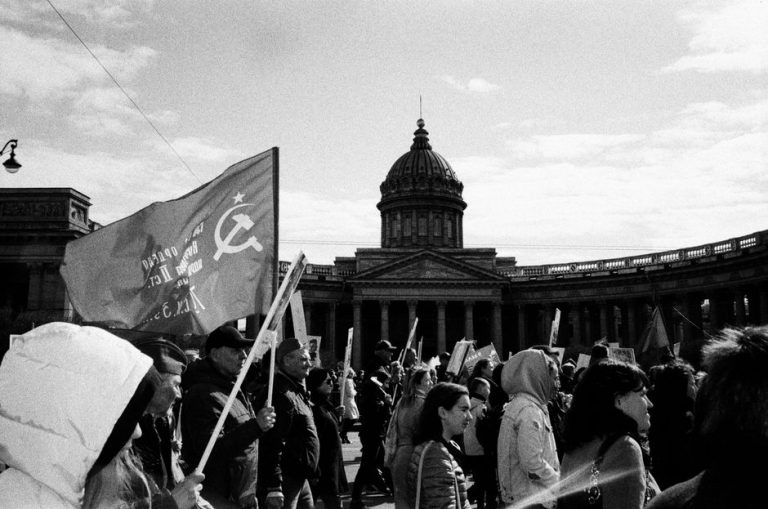 Black and white image of a political protest in front of the Kazan Cathedral.