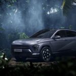 Hyundai Kona Electric SUV in a misty tropical forest setting, exuding adventure.