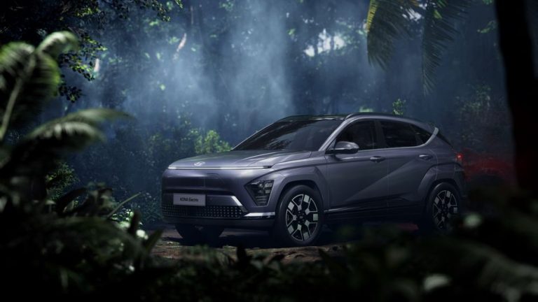 Hyundai Kona Electric SUV in a misty tropical forest setting, exuding adventure.