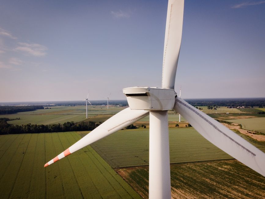 Aerial view of wind turbines generating renewable energy in rural Poland.