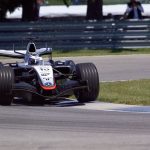 McLaren MP4-20 speeding during Indianapolis Formula 1 event.