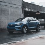 Blue Volvo SUV parked in a modern urban environment showcasing sleek design and urban lifestyle.