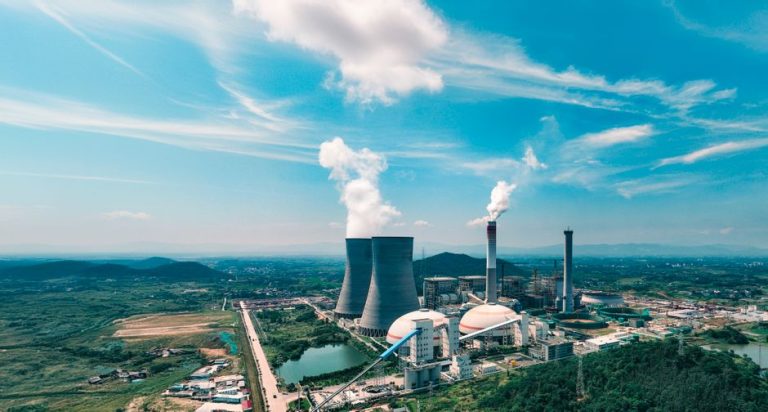 Aerial view of an industrial power plant near Jiujiang, showcasing infrastructure and landscape.