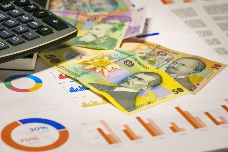 Romanian banknotes with graphs and calculator illustrating finance concepts.
