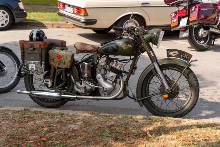 Classic 1949 Sarolea motorcycle parked on street, showcasing vintage design.