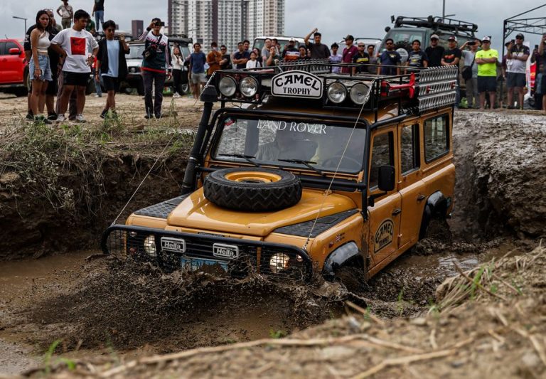 A Land Rover navigating muddy terrain during an off-road event in Pasig, Philippines.