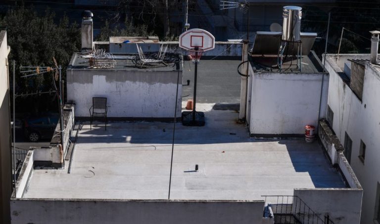 Rooftop basketball hoop on a concrete surface in Athens, Greece.