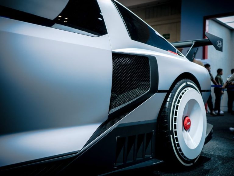 Close-up of a Hyundai concept car showcased in an indoor exhibition with modern design details.