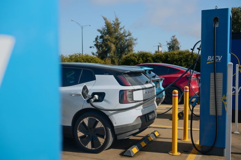 Electric vehicles charging at a RACV station in Barnawartha, VIC, Australia, promoting sustainable transportation.