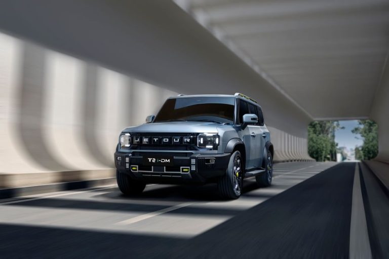 Jetour T2 SUV cruising through a contemporary tunnel, showcasing sleek modern design.