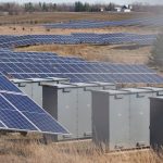 Expansive solar panel field in a rural area harnessing solar energy. Sustainable and renewable energy source.