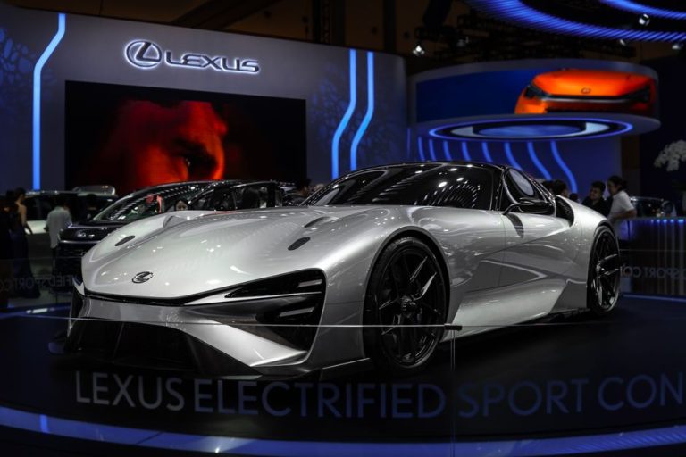 Lexus Electrified Sport Concept car showcased at an indoor auto exhibition with modern lighting.