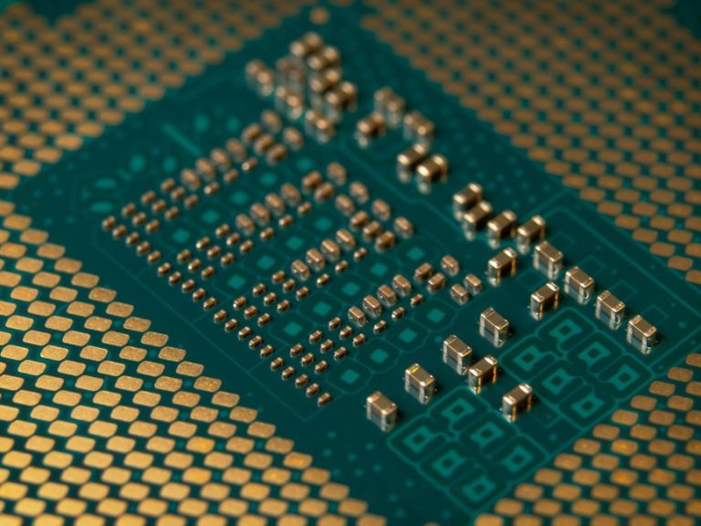 Detailed close-up of a microprocessor circuit board showcasing intricate circuitry and components.