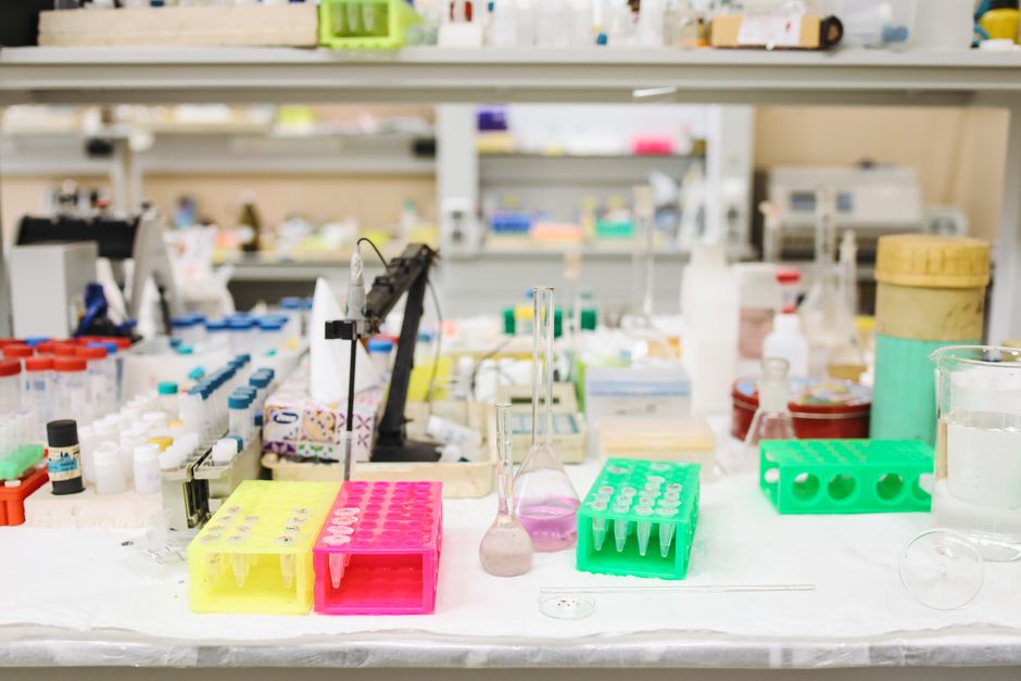 Bright and organized scientific laboratory with various equipment and test tubes.