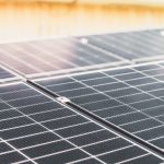 Detailed view of a rooftop solar panel array capturing sunlight for renewable energy production.