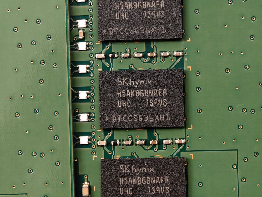Detailed view of SK hynix DRAM chips on a green circuit board featuring electronic components.