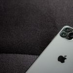 Close-up of a smartphone highlighting its modern design on a dark background.