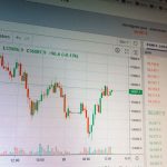 Close-up of digital cryptocurrency market graph showing price fluctuations and trading data.