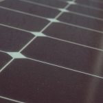 Detailed view of solar panel cells for alternative energy generation and innovation in technology.