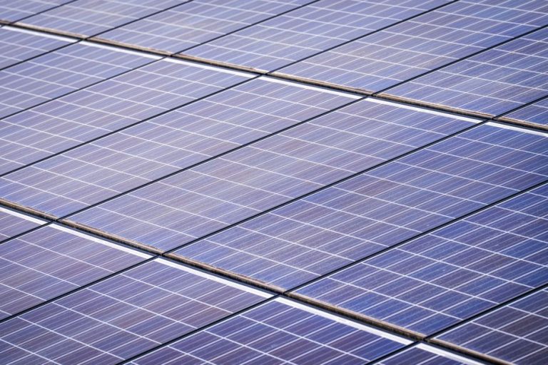 Close-up of a solar panel array capturing renewable energy on a sunny day.