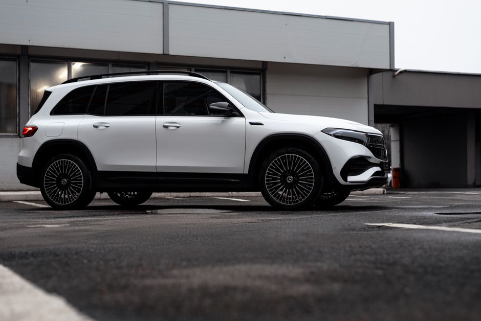 Modern white Mercedes-Benz EQB SUV parked outdoors showcasing luxury and style.