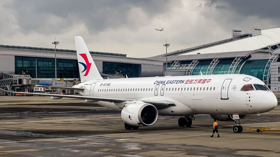 China Eastern Airlines aircraft parked at an airport terminal, ready for its next journey.