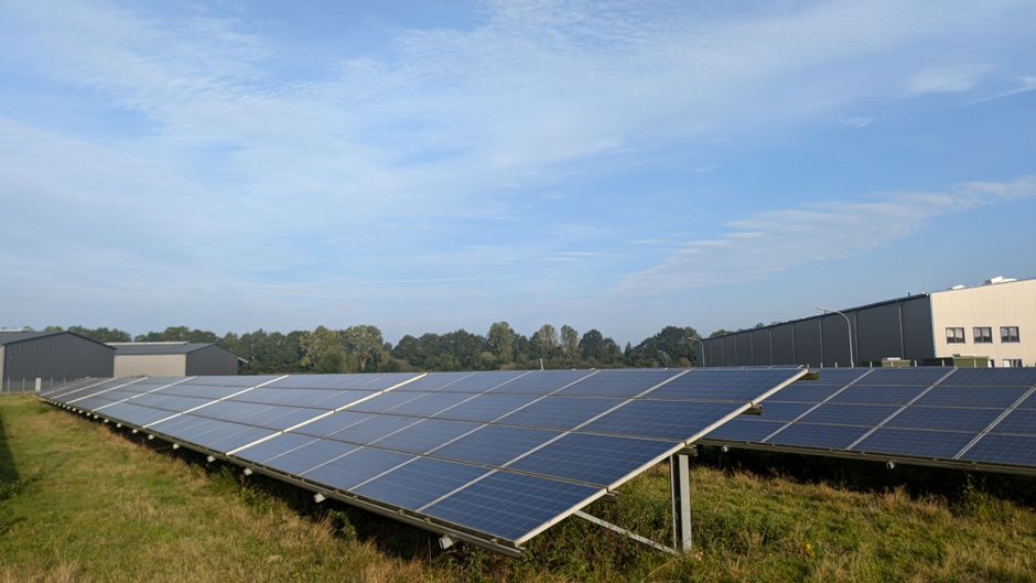 Solar panels in a Ratzeburg field, capturing renewable energy on a clear day.