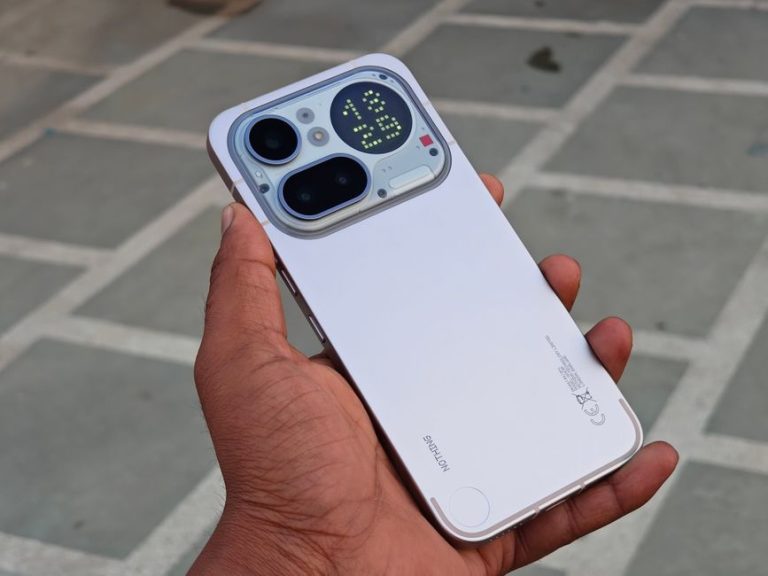 Close-up of a modern smartphone showcasing rear display and camera features.