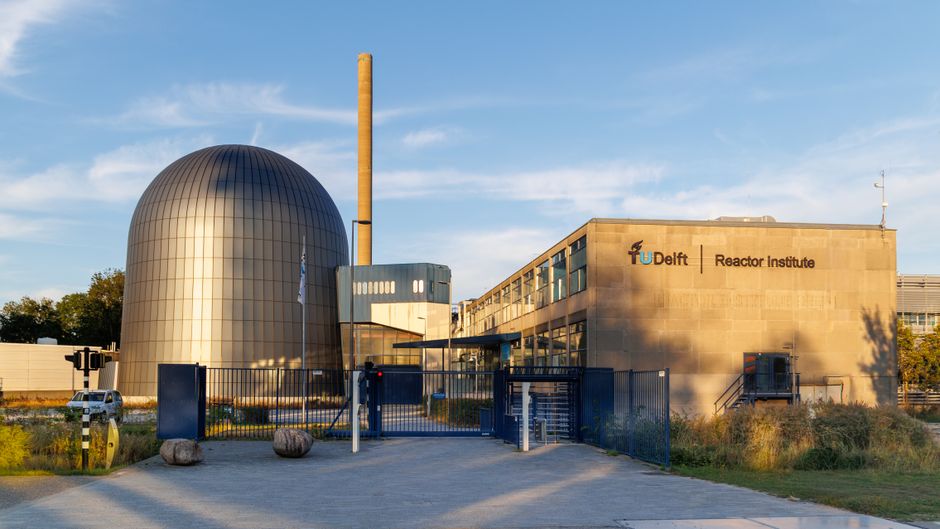Front view of the TU Delft Reactor Institute, Netherlands in daylight.