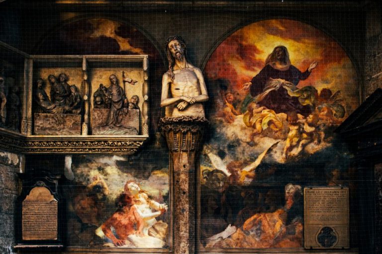Historic religious art including sculptures and paintings inside St. Stephen's Cathedral, Vienna.