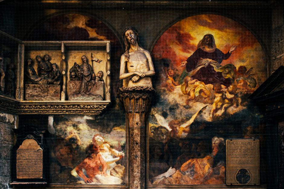 Historic religious art including sculptures and paintings inside St. Stephen's Cathedral, Vienna.