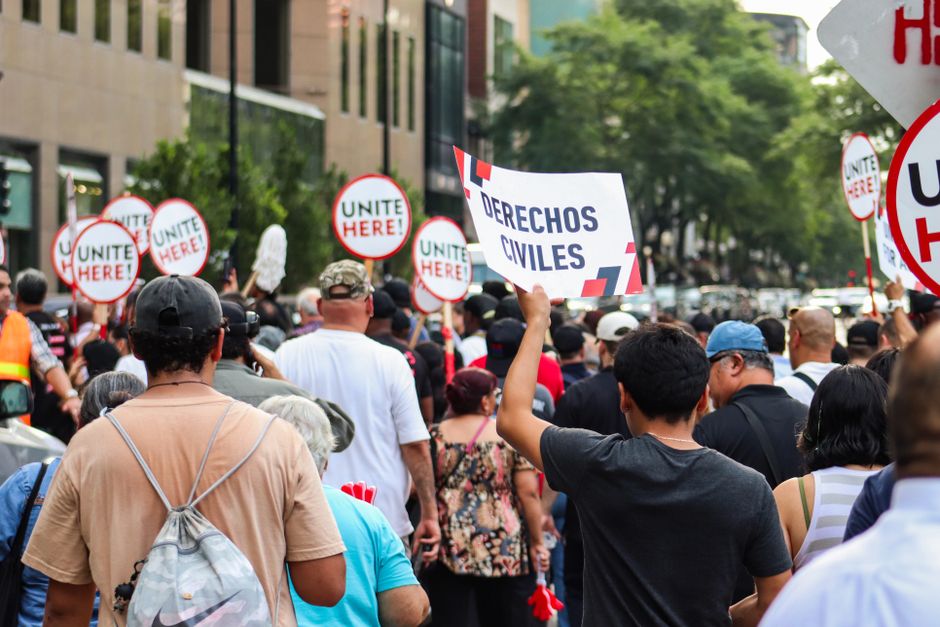 Protest in Chicago advocating for workers' rights, unity, and equality.