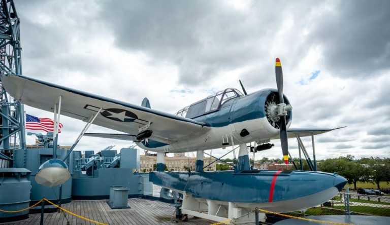 A vintage aircraft displayed on a battleship deck in Wilmington, NC.
