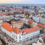 A stunning aerial view of Timișoara, highlighting historic buildings and urban landscape.