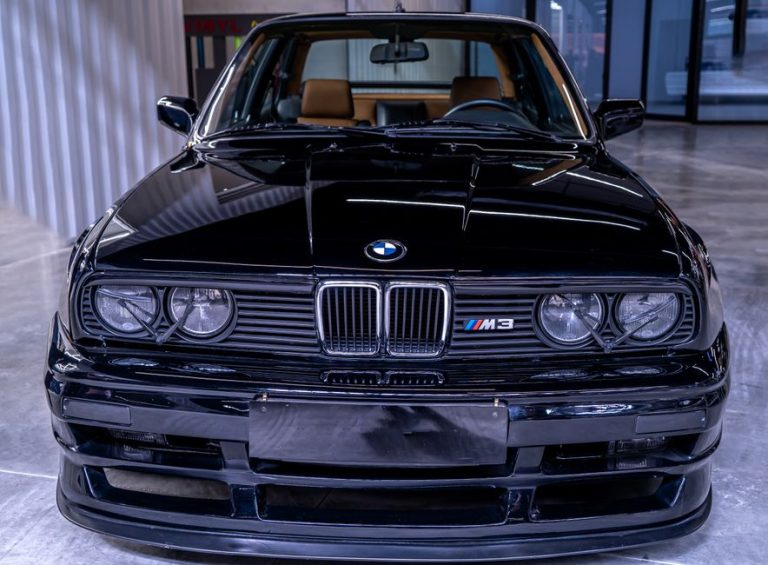 Front view of a classic BMW E30 M3, showcasing its iconic design and vintage style.